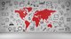 Large wall mural of the world's continents in red, surrounded by black and white illustrated icons like a laptop, folder, chart, email, pyramid, lightbulb, etc. [Image by creator Robert Kneschke from AdobeStock]